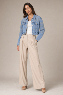 Load image into Gallery viewer, Embellished Light-Wash Denim Statement Jacket styled on model against a stone gray studio background