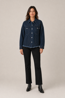 Load image into Gallery viewer, dark-indigo-studded-denim-jacket — slot 06 restored age-25 boots editorial model front v5 restored final