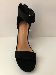 Black strappy party shoes. Strappy high heels. Open toe sandal high heels in black with large straps. Chunky heel. Secure fit with zipper closed heel backing. Good for parties and fancy events. Party shoes