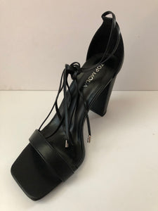 Open toe sandal high heels with leather lace ties in sleek black. Chunky heel. Secure fit with leather shoelaces. Open toe sandal heel. Square front. Good for parties and fancy events