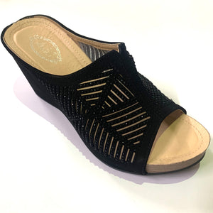 Black slip-on wedge sandals with rhinestones and a cut-out pattern decorating the strap.  Easy to slip on. Black crystals embellishing the upper strap.