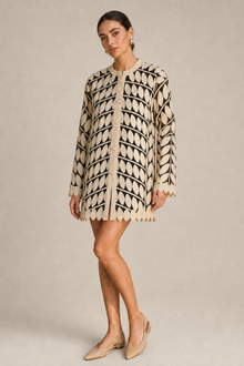 Load image into Gallery viewer, cream-laser-cut-jacket-02 — stone gray editorial model three-quarter image
