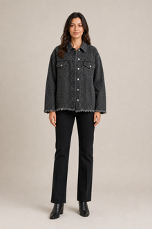 Load image into Gallery viewer, black-studded-denim-jacket — slot 06 restored age-25 boots editorial model front v5 restored final
