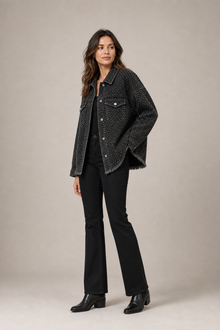 Load image into Gallery viewer, black-studded-denim-jacket — slot 07 restored age-25 boots editorial model three-quarter v5 restored
