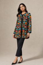 Load image into Gallery viewer, black-multicolor-floral-embroidered-jacket — stone gray editorial model three-quarter image
