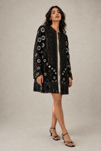 Load image into Gallery viewer, black-fringe-embroidered-jacket — stone gray editorial model three-quarter image
