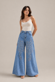 Load image into Gallery viewer, Floral Appliqué Wide-Leg Denim Pants — stone gray editorial model three-quarter image
