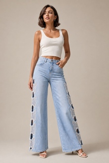 Load image into Gallery viewer, Butterfly Cutout Wide-Leg Jeans — stone gray editorial model three-quarter image
