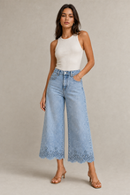 Load image into Gallery viewer, light-blue-wide-leg-denim-pants-scalloped-lace-hem — stone gray editorial model three-quarter image
