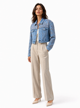 Load image into Gallery viewer, embellished light wash denim jacket pair 02 - editorial-model-three-quarter
