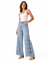 Load image into Gallery viewer, light wash eyelet floral cutout wide leg jeans - editorial-model-three-quarter
