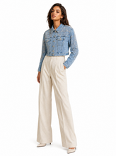 Load image into Gallery viewer, embellished light wash denim jacket pair 01 - editorial-model-three-quarter

