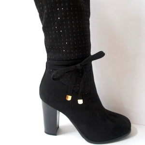 Crystal-embellished black knee-high boots with a side-bow on the ankle. Inner side zipper. Suede-like upper with black crystal embellishments. Block heel.
