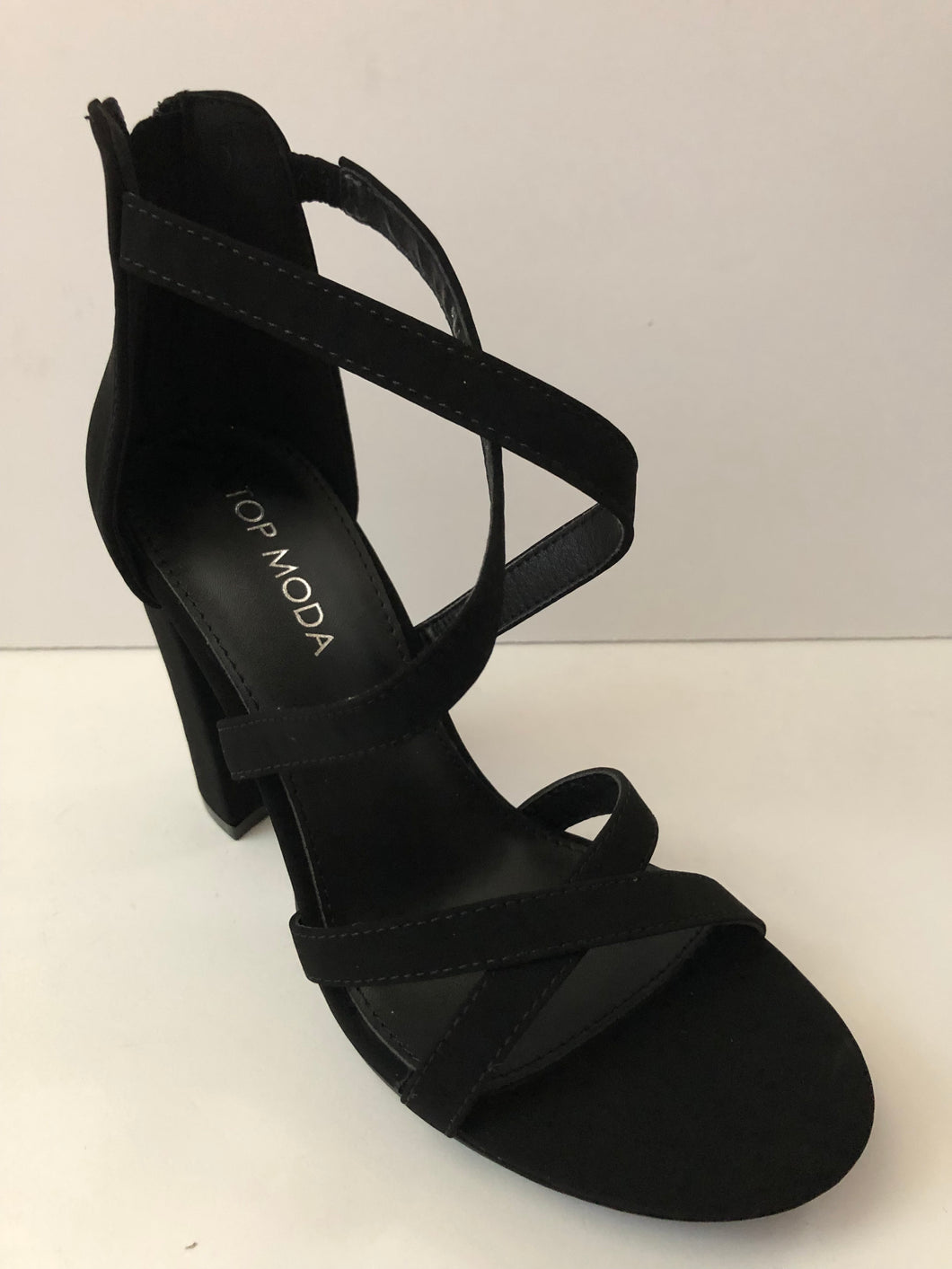 Black Crisscross Strap Sandal High Heels. Party shoes high heels. Sandal high heels with decorative crisscross straps in black. Chunky heel. Secure fit with zipper closed heel backing. Open toe sandal heel. Good for parties and fancy events.