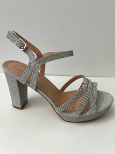 Glitter and crystal embellished platform sandal heels. Good for parties and formal occasions. Platform for additional support. Ankle strap to keep foot in place. Three decorative straps at front of shoe for decoration. Comes in gold, silver, and black. Silver color.