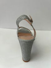 Load image into Gallery viewer, Glitter and crystal embellished platform sandal heels. Good for parties and formal occasions. Platform for additional support. Ankle strap to keep foot in place. Three decorative straps at front of shoe for decoration. Comes in gold, silver, and black. Silver color.
