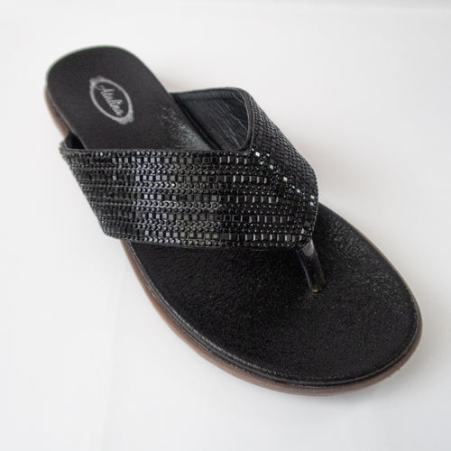 All black flip-flops with crystal-embellished straps.
