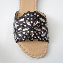 Load image into Gallery viewer, Black slip-on flat sandals embellished with silver crystals.
