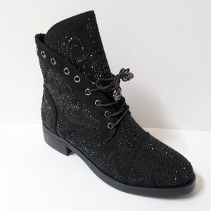 Black ankle booties with skull shoelaces and crystal embellishments. Slight heel. Black crystal embellished upper. Shoelaces with a skull aglet.