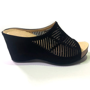 Black slip-on wedge sandals with rhinestones and a cut-out pattern decorating the strap.  Easy to slip on. Black crystals embellishing the upper strap.
