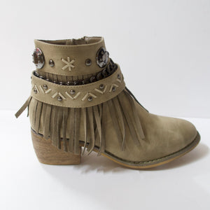 Tan/beige ankle booties with fringe design and embellished strap upper. Suede-like material. Slight heel. Decorated upper with a chain, embellished strap, and fringe. Inner side-zipper.