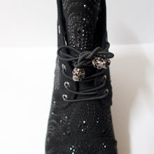 Load image into Gallery viewer, Black ankle booties with skull shoelaces and crystal embellishments. Slight heel. Black crystal embellished upper. Shoelaces with a skull aglet.

